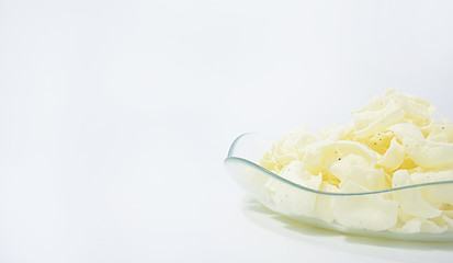 golden potato chips on a white background