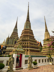 Fototapeta premium Beautiful stupas in the Phra Maha Chedi Si Ratchakan area of Wat Pho (Buddhist temple) in Bangkok, Thailand