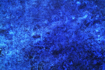 Grunge blue stained backdrop.