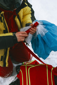 Packing the parachute before a BASE jump.