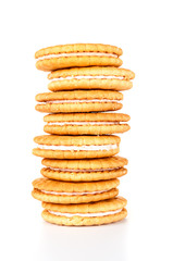 Stack of biscuit cookies isolated on white background