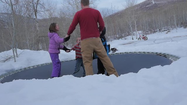 Slow motion trampoline fun in the winter time with dada and the kids.