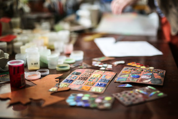 Fototapeta premium artist's studio samples of enamels on table, top view