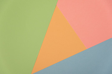 Colorful soft green, orange, cyan and pink paper background.