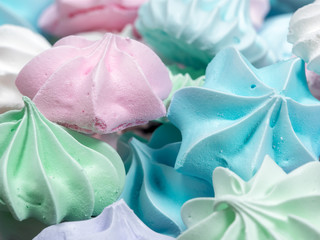 Close-up view of colorful mini meringue cookies