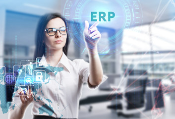 The concept of business, technology, the Internet and the network. A young entrepreneur working on a virtual screen of the future and sees the inscription: ERP