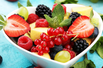 salad with fresh fruits and berries. healthy spring fruit salad