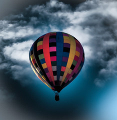 Fototapeta na wymiar Hot Air Balloon against a Dramatic Sky