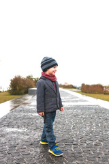 Fototapeta premium The boy is on a walk.
