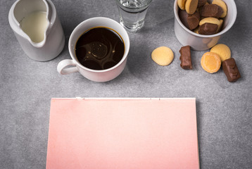 Obraz na płótnie Canvas Time for break, coffee, chocolate and pink notebook
