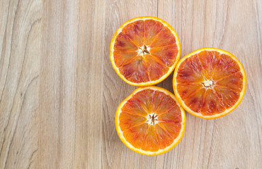 Fresh orange, organic ripe mandarins, sliced orange on wooden table background, top view