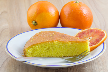 Naklejka na ściany i meble Cake, Homemade cakes come from citrus fruits and orange slide in plate on wood table background.