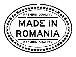 Grunge black premiumq quality made in Romania oval rubber seal business stamp on white background