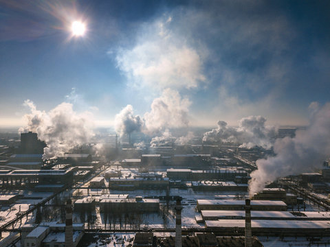 Aerial view of factory smoke stack - Oil refinery, petrochemical or chemical plant in winter © vladstar