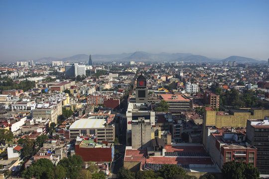 Aerial view of a neighborhood called Colonia Juarez in Mexico City, Mexico, on a sunny morning with some haze.