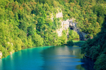 Fototapeta na wymiar Panoramic view of waterfalls, rocks and lakes from popular tourist viewpoint in Plitvice Lakes National park. Amazing nature summer landscape, famous landmark in Croatia