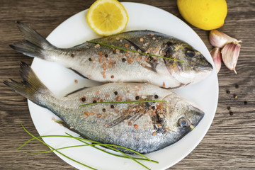 Fresh Raw Sea Bream Fish with Lemon