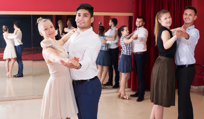 People dancing together slow ballroom dances