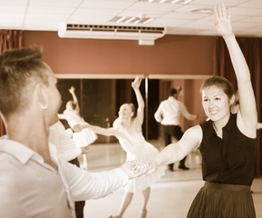 Dancing couples enjoying latin dances