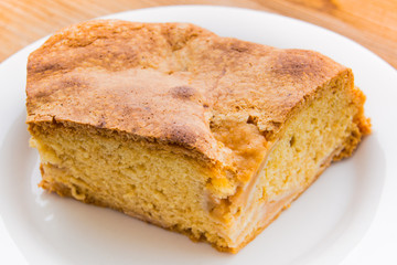 A pice apple pie Charlotte on the saucer.