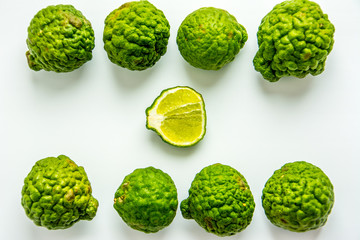 Bergamot on the white background. Citrus bergamia, the bergamot orange is a fragrant citrus with a yellow or green color similar to a lime. - obrazy, fototapety, plakaty