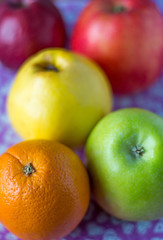 colored apples on background with hearts