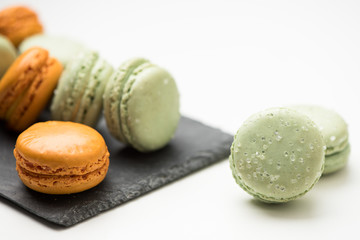 Tasty sweet macarons. Macaroons on white table.