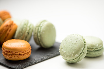 Tasty sweet macarons. Macaroons on white table.
