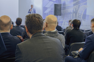 rear view of a man attending a business conference