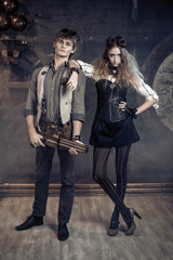 Fototapeta na wymiar Portrait of a young beautiful loving couple in steampunk style.