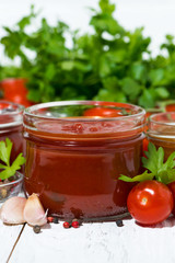 assortment of tomato sauces and ingredients, closeup vertical