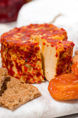 delicacy cheese with herbs and snacks, closeup