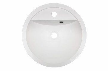 White oval washbasin in the bathroom of an artificial stone