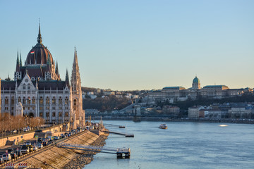 Fototapeta na wymiar Budapest parliament and Chain Bridge and palace at the river Danube during sunset from the side