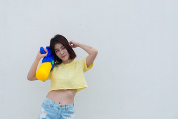 Asian sexy woman with water in hand on white background,Festival songkran day at thailand,The best of festival of thai,Land of  smile