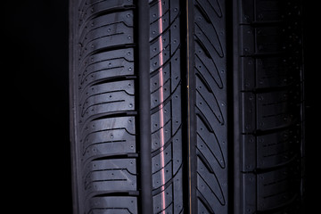 A new car tire isolated on black