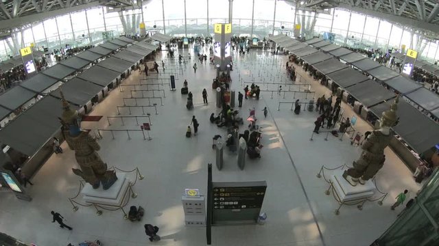 4K Traveler crowd at airport check in counter hall