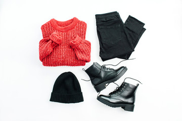 Woman fashion trendy cloth collage on white background. Red sweater, jeans, hat and shoes. Flat lay, top view minimal set.