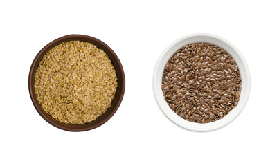 golden and brown seeds of flax on white background. Top view. golden and brown seeds of flax in a bowl isolated on white background. Seeds of flax with copy space for text.
