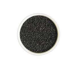 Black sesame on white background. Top view. Black sesame in a bowl isolated on white background. Sesame with copy space for text.