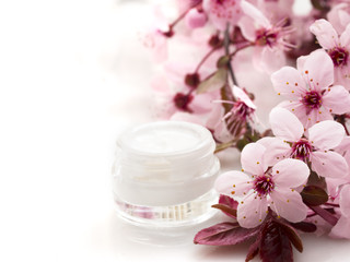 cosmetic product with spring flowers, fresh as spring concept