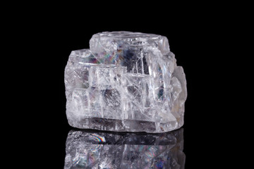 Macro mineral stone Iceland spar on black background