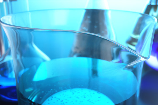 3d illustration of a chemical reaction, the concept of a scientific laboratory on a blue background. Flasks filled with colored liquids with different compositions
