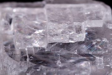 Macro mineral stone Iceland spar on black background