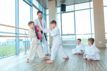 young, beautiful, successful multi ethical kids in karate position