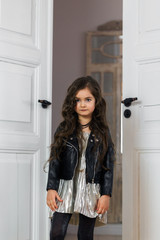 Stylishly dressed girl in a leather jacket