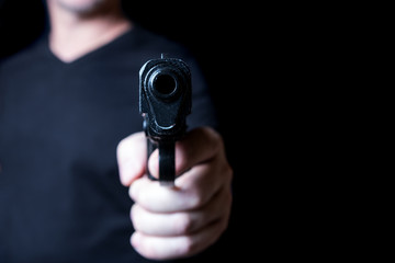 gun in the hand of man