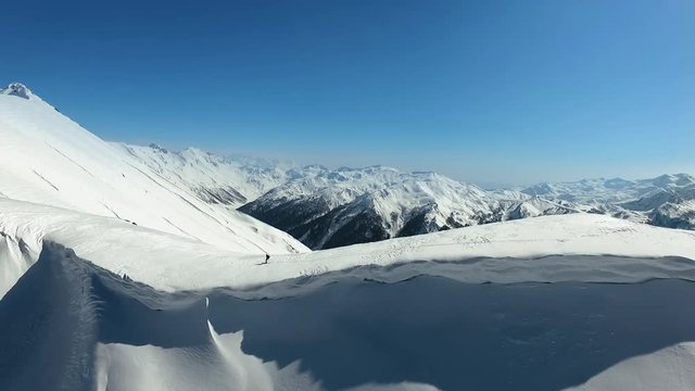 Aerial Men Go Skitour In Snow Moutains