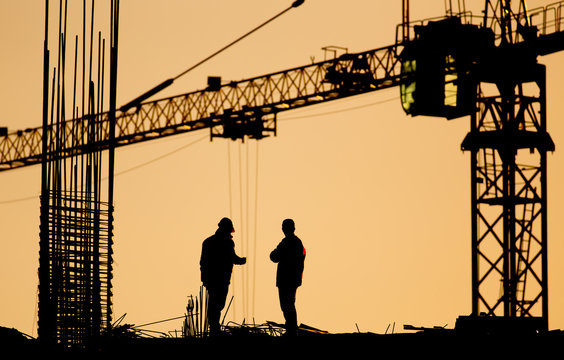 Engineer and worker at building site