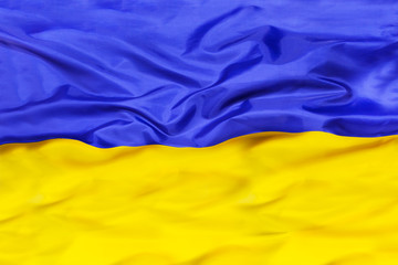Ukraine national flag with waving fabric 